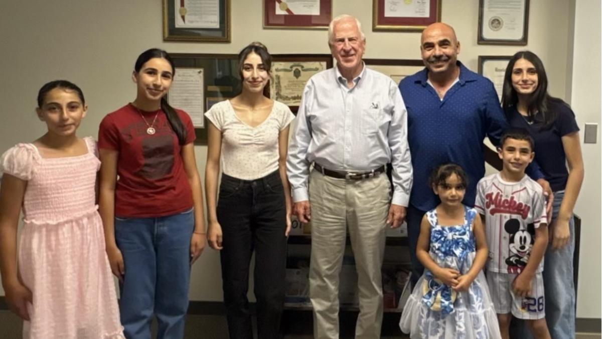 Rep. Thompson stands with members of the Rustom family in Napa