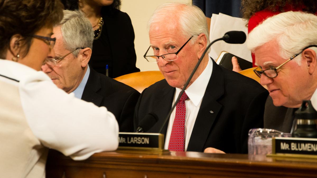 Thompson speaks with other Members on the ACA markup