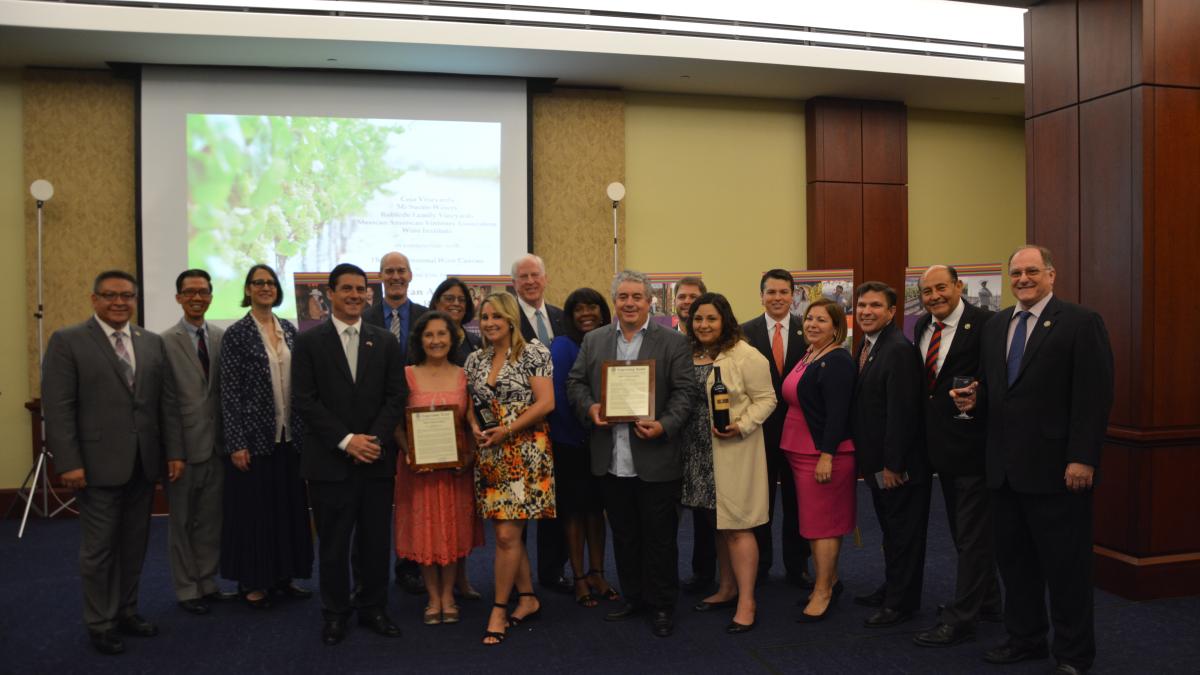 Thompson, Members of Congress present Ceja Vineyards and Mi Sueño Winery with certificates of Congressional Recognition.