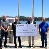 Phot of Rep. Thompson and representatives from Rio Vista holding a large check 