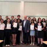 Photo of Rep. Thompson standing with Student Leadership Council graduates holding certificates
