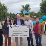 Group photo with Rep. Thompson holding a check 