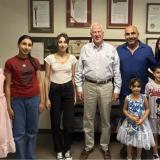 Rep. Thompson stands with members of the Rustom family in Napa
