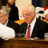 Thompson speaks with other Members on the ACA markup