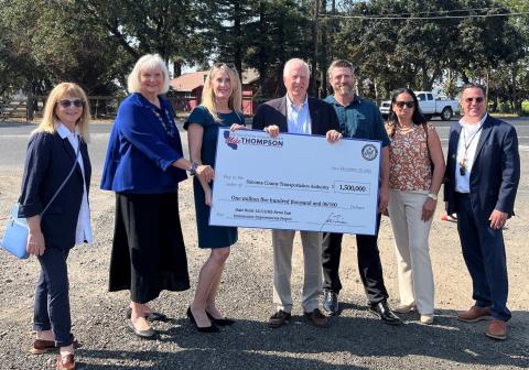 Photo of Rep. Mike Thompson presenting a check to Sonoma County Transportation Authority officials 