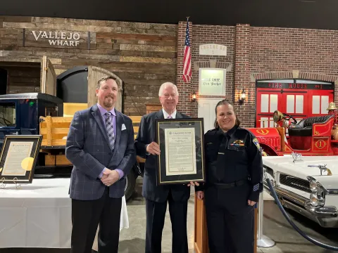 Rep. Thompson stands with Officer Coughlan and the Congressional Record Statement