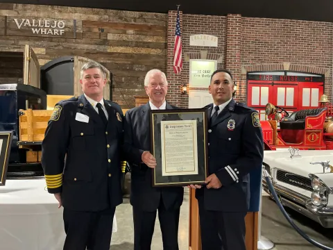 Rep. Thompson stands with Andrew Tomelloso and the Congressional Record Statement