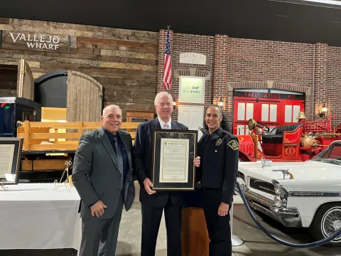 Rep. Thompson stands with Deborah Lamasion and the Congressional Record Statement