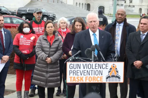 Rep. Thompson speaks at a podium announcing gun violence prevention discharge petition