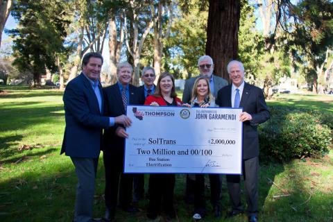 Rep. Thompson and Rep. Garamendi present a check to SolTrans leaders.