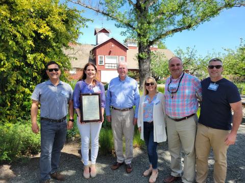 Rep. Thompson presenting the award to Janelle Sellick