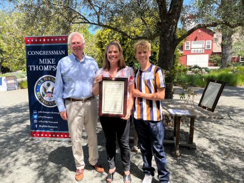 Rep. Thompson presenting the award to Nicole Braddock