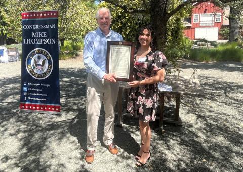 Rep. Thompson presenting the award to Valeria Cantor Méndez