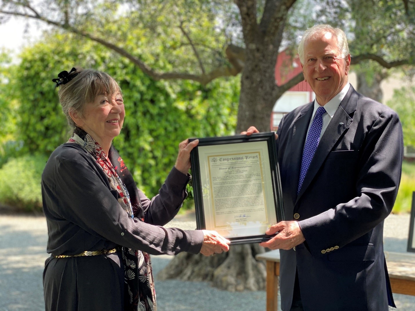 Rep. Thompson presenting the award to Victoria Brandon