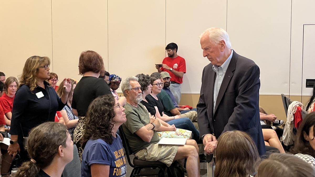 Rep. Thompson listens to a community member's concerns at a July 31st listening session at UC Davis on federal cuts to research funding. 